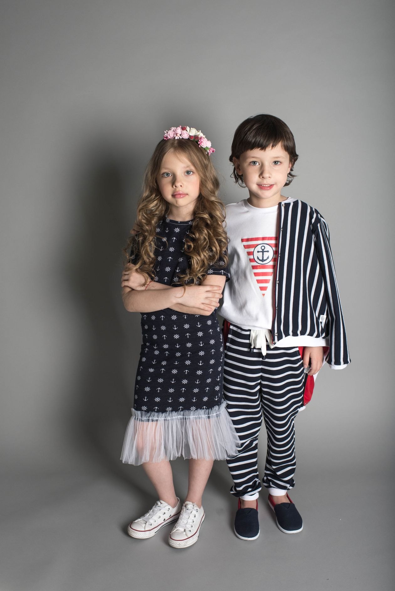 Little girl and boy in a studio portrait